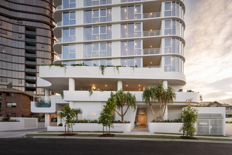 Lily by Mosaic in Broadbeach, a white apartment tower with curved balconies over a rendered podium and entry